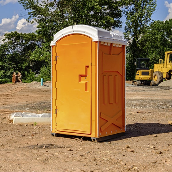 what is the cost difference between standard and deluxe portable restroom rentals in Evans